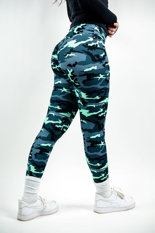 Beautiful Zoe is wearing size small mint camo leggings. Hips are 39 inches and waist 27 inches. Mint camo fabric runs smaller in size, so size up if in between sizes.